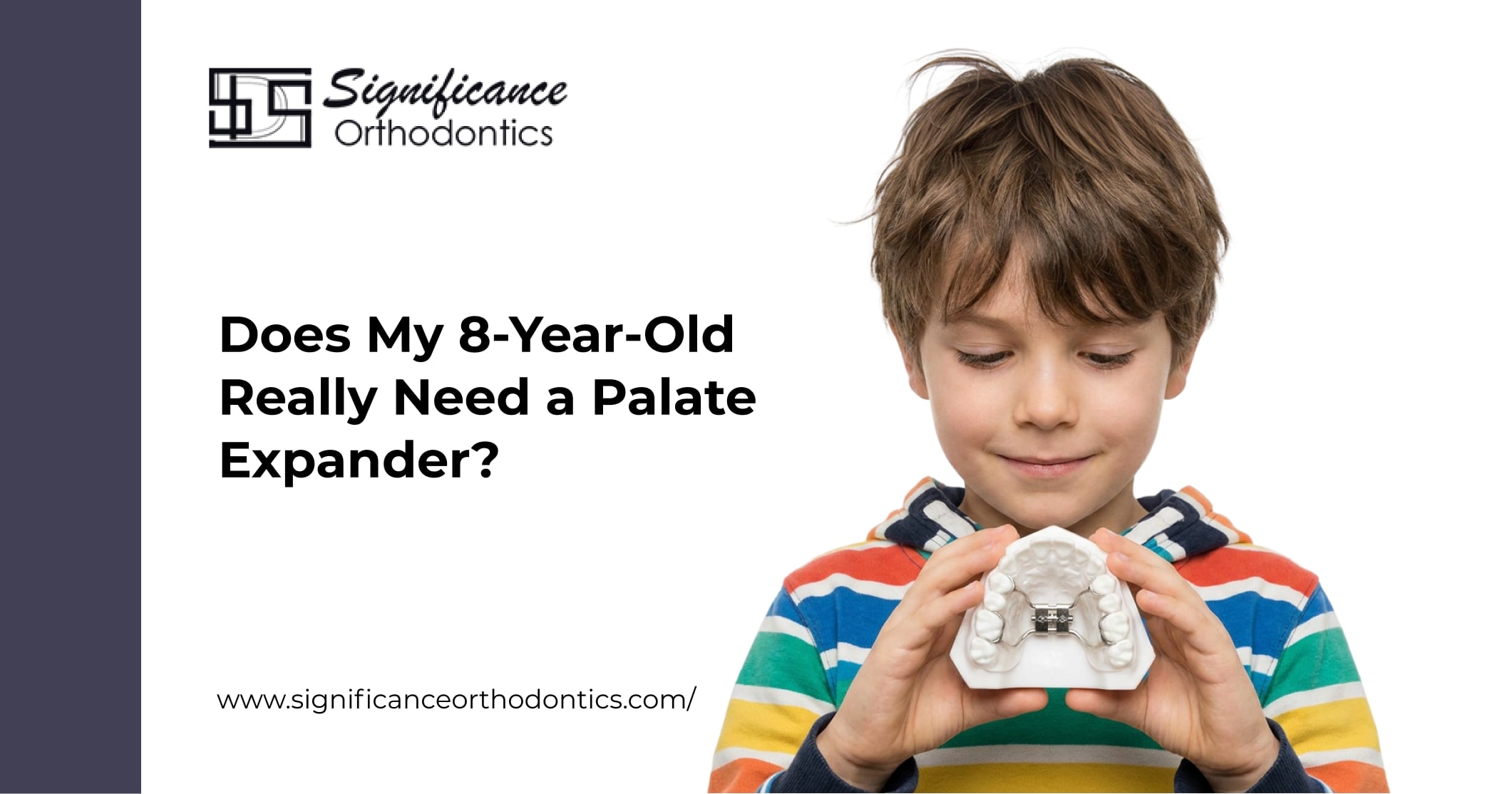 Young boy holding a dental model with a palate expander for Significance Orthodontics