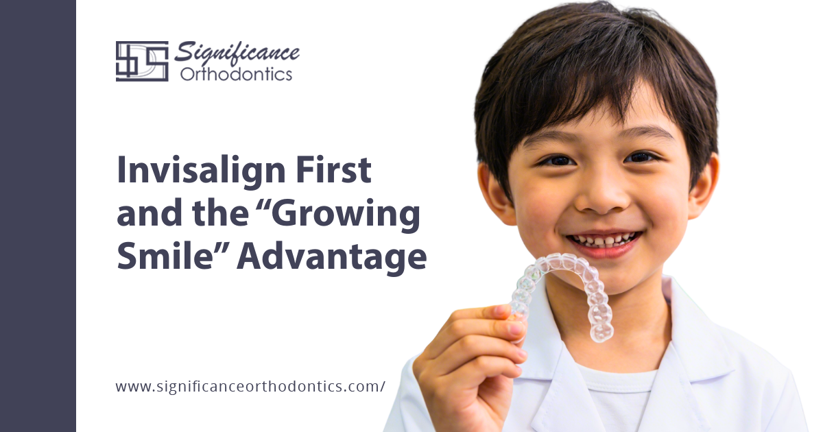 smiling boy holding invisalign first aligner