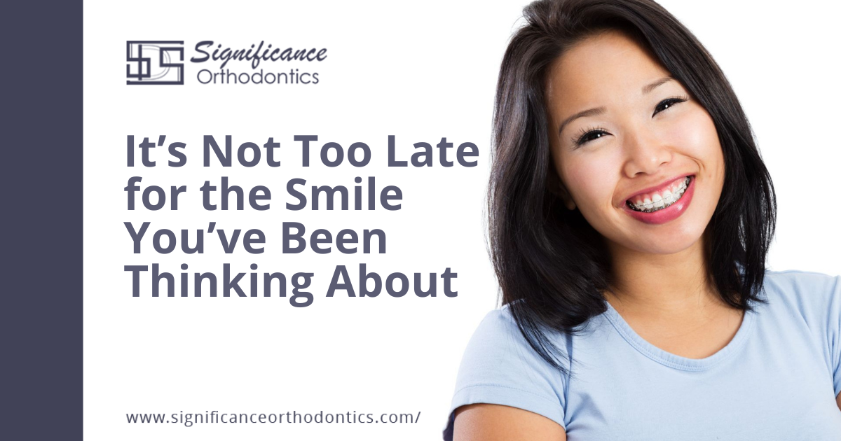 Smiling woman with dental braces on her teeth.